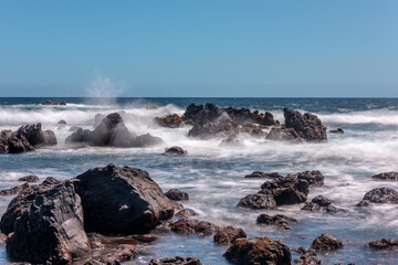 Rugged Hawaiian Shoreline and crashing water over lava reef