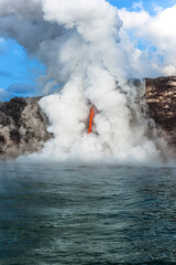 Lava tube flowing into ocean in Hawaii at dawn