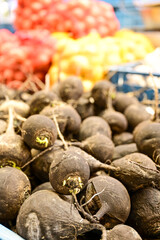 Radish at Holesovice Market, Holesovicka trznice in Prague, lively marketplace with stalls selling...