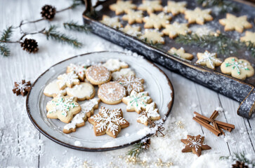 Fototapeta premium Yummy christmas cookies with a beautiful star sugar coating on a rustic wooden table - AI generated