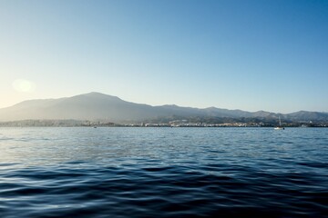 Mediterranean Sea horizon with Estepona city and Sierra Bermeja mountain in the background, Malaga,...