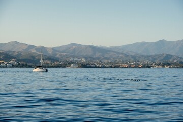 Mediterranean Sea horizon with Estepona city and Sierra Bermeja mountain in the background, Malaga, Spain