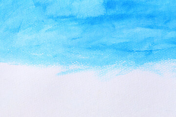Blue watercolour paint brush on the white art paper background.
