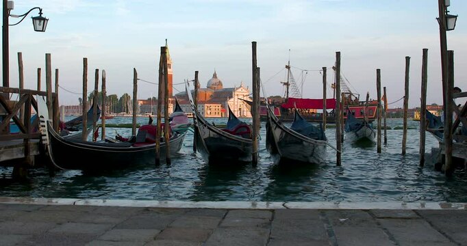 Gondolas Docked on the Waterfront at Sunset Venice Italy