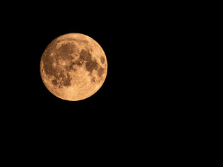 Red Dust Moon over the UK with dark night sky background