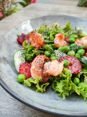 Shrimp salad with strawberry fruit and cucumber using with sour cream and mayonaise