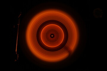 Music Dj concept. Trail of fire and smoke on vinyl record. Burning vinyl disk. Turntable vinyl record play Selective focus