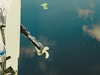 Propeller of boat on sea coast.