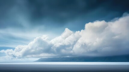 A serene landscape featuring dramatic clouds above a calm sea, evoking tranquility and the beauty of nature.