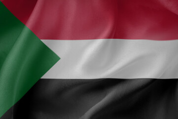 Sudan waving flag close up fabric texture background