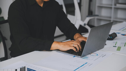 Financial analysts analyze business financial reports on a digital tablet planning investment project during a discussion at a meeting of corporate showing the results of their successful teamwork.