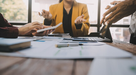 Group of Young Asian business team creative businesspeople coworker in office Happy to be successful partnership teamwork celebrating achievement and success concept.