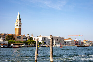 View of the Grand Canal in Venice featuring the Campanile and historic buildings under a clear blue sky