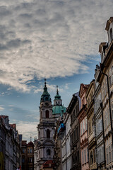 Historic architecture overlooking a cloudy sky in a European city during late afternoon