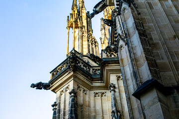 Gothic architecture of St. Vitus Cathedral in Prague during a clear day with bright blue skies...