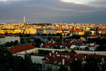 Sunset over Prague showcasing the Vltava River, historic architecture, and vibrant city landscape in golden hour lighting