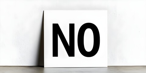 A clean and straightforward stock photo featuring a poster with the word "NO" prominently displayed in the center, set against a white background.