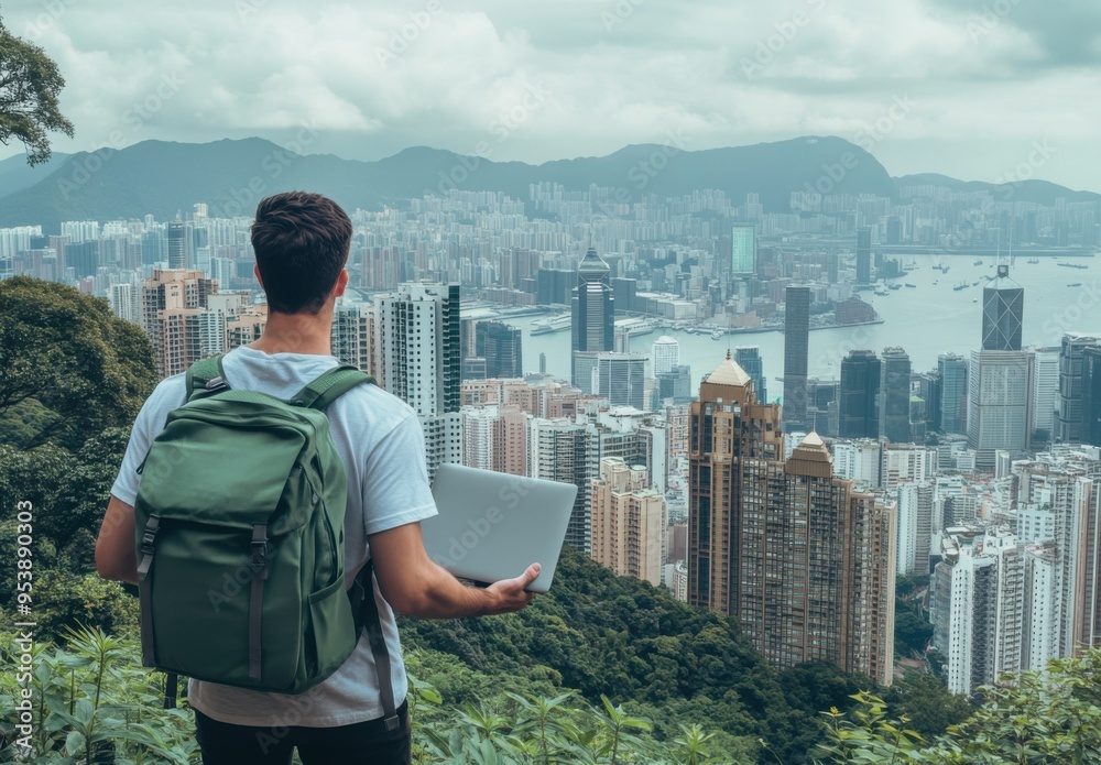Aufkleber a man with a laptop in a green backpack stands on the top of a mountain and looks at the cityscape. 