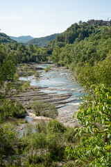 aqua blue clear mountain river water flowing through a stone gorge 
