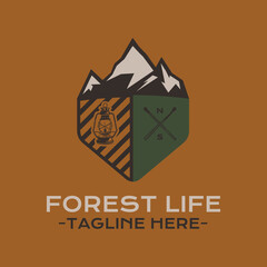 Forest Life badge design with mountains, lantern and matches. Travel logo graphics. Stock camping label