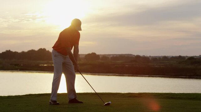 Professional Golfer Sunset Teeing Off 