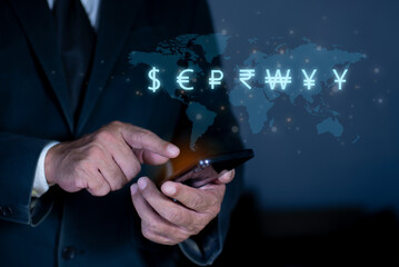 Global business man and Global currency concept, money, finance, Businessman using smartphone with virtual world map and dollar yuan yen euro ruble rupees and pound sterling sign.