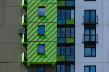 Elements of architectural decorations of buildings, modern windows, walls and balconies.