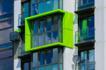 Elements of architectural decorations of buildings, modern windows, walls and balconies.