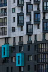 Obraz premium Elements of architectural decorations of buildings, modern windows, walls and balconies.