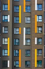 Obraz premium Elements of architectural decorations of buildings, modern windows, walls and balconies.