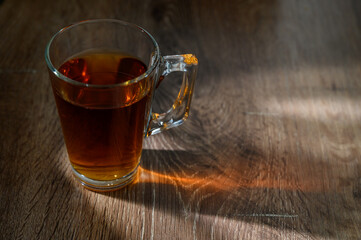 cup of hot tea on wooden table