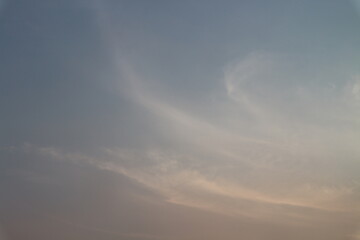 Evening sky has dark clouds and sunlight.