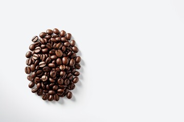 there is a pile of coffee beans on a white surface                          