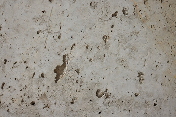 A Visually Textured Surface Featuring Distinctive Footprints and Various Markings