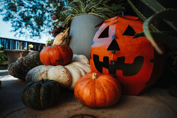 Rustic Autumn Harvest: A Festive Pumpkin Display with a Halloween Jack-o’-Lantern