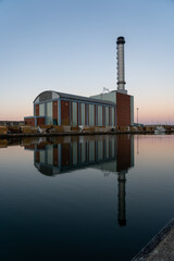 Reflections of a gas fired power station at dawn.