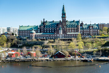 Fototapeta premium Stockholm, Sweden, The retirement home Danvikshem on a cliff in the district Nacka a sunny spring day seen from seaside