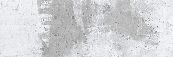Texture of old concrete wall. Rough gray concrete surface with white spots. Wide panoramic background for design.