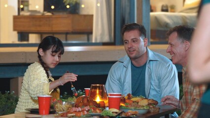 Family gather celebrate holiday. Parents, grandparents and girl together to talk and have dinner party food. Outdoor activity for spending time with multigeneration cross generation gap. Divergence.