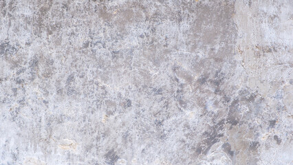 Obraz premium A grey wall abctract texture background with a few scratches and marks. The wall is very plain and has no decoration