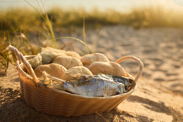 Christianity, religion, Bible concept. Five loaves of bread and two fish