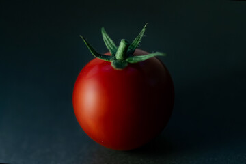red tomato on black