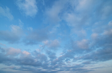 Beautiful tender sunrise sky with clouds. Sky background.