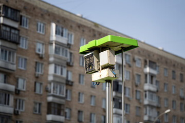 speed control camera emerges from a specialized vehicle, integrated into an urban landscape, highlighting modern surveillance technology in city traffic management