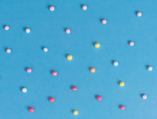 colorful round sprinkles  pattern on blue background