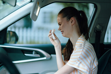 woman crying in car, emotional expression, seeking comfort, distress, sadness, interior shot, casual clothing, natural light, highlighting vulnerability and reflection