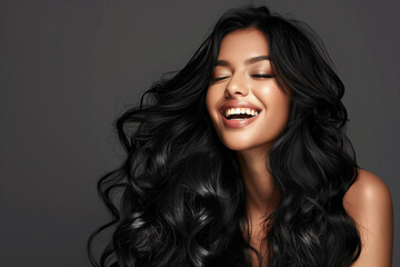Naklejka premium Women in Black curly hair. Fashion Girl Portrait. long Hair with beautiful skin in grey background. Hair oil.