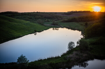 Nature landscape with the lake in sunset