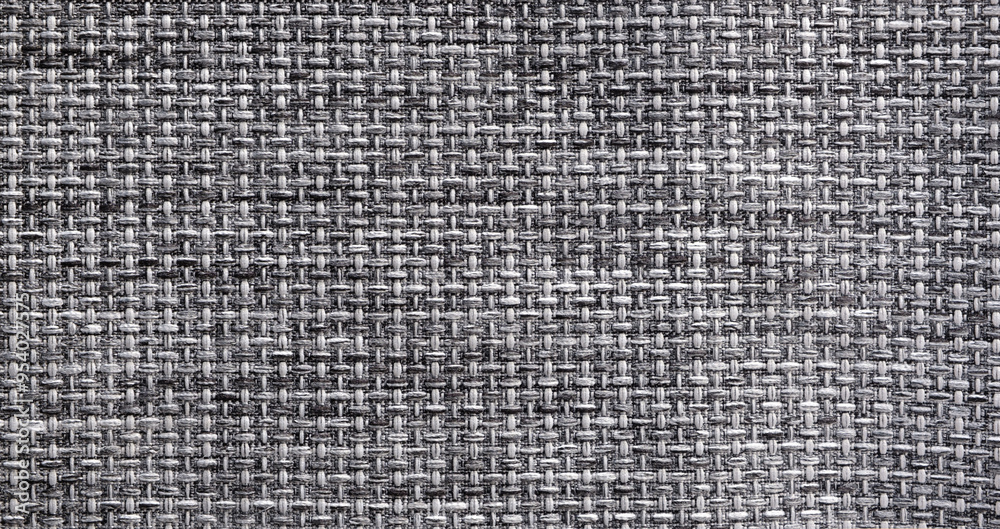 Poster A close up of a gray and black fabric with a pattern texture background. The fabric is woven and has a rough texture