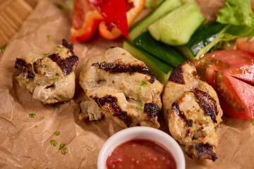 Deliciously Grilled Chicken Platter served alongside Fresh Colorful Vegetables and Sauce